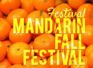 Bright mandarins stacked together with bold yellow text overlay that reads “Mandarin Fall Festival,” promoting the annual fall celebration in Jacksonville, Florida.